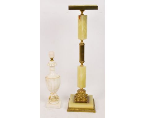 A large standard onyx and gilt metal ashtray of square design raised on a column plinth base, height 63cm and a baluster shap
