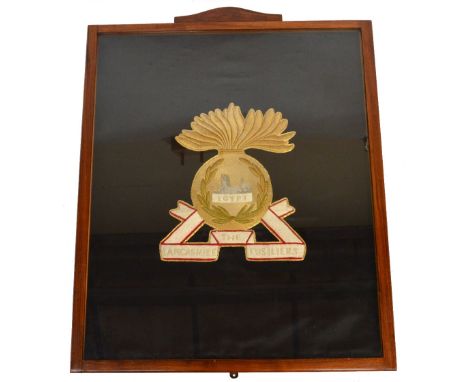 A large framed and glazed needlework tapestry inscribed "The Lancashire Fusilier Egypt", with gold thread border.