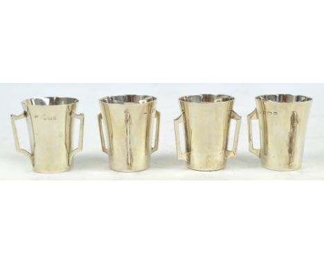 A set of three Edward VII hallmarked silver tot tygs, retailed by Mappin & Webb, William Aitken, Birmingham 1904 and a simila