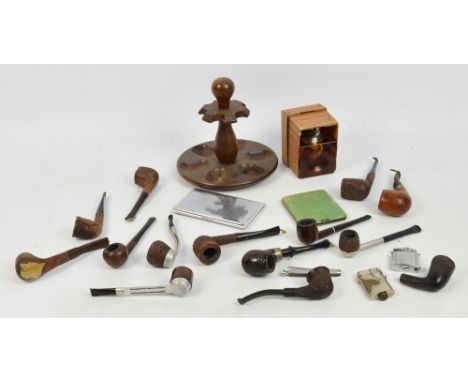 A group of smoking paraphernalia including a pipe rack, pipes, a shagreen cigarette case (badly damaged), lighter, etc.