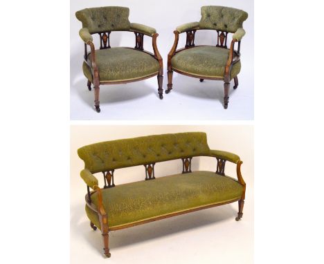 A late Victorian/Edwardian rosewood and satinwood inlaid four piece salon suite, comprising button upholstered settee, pair o