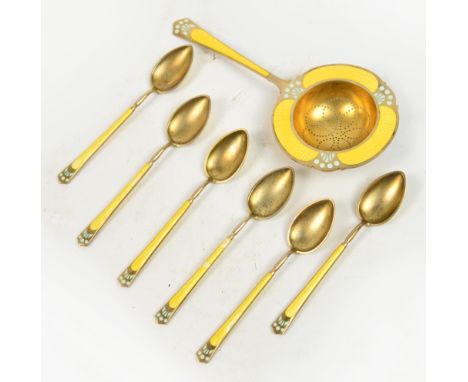 A set of six Norwegian silver gilt yellow and turquoise guilloche enamelled coffee spoons with a matching strainer, length 13