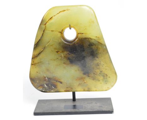 A polished jade axe head with tapering cut ring for handle attachment, 17 x 17cm.