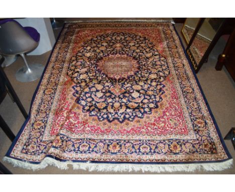 A blue ground Keshan carpet, 280 x 200cm.
