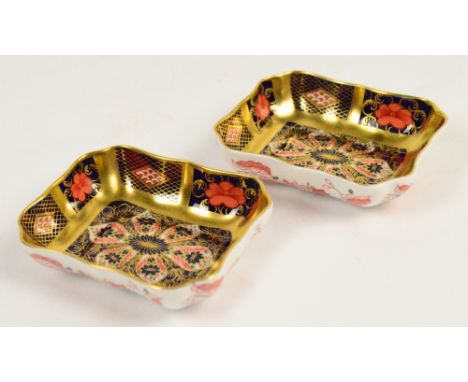 A pair of Royal Crown Derby Imari decorated trinket bowls of shaped rectangular form, both with printed marks, numbered 1128,