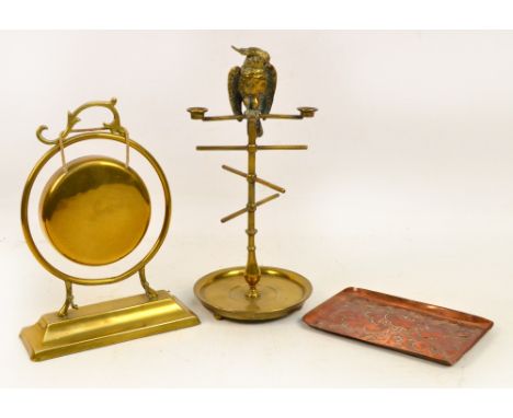 An unusual early 20th century brass ink stand, with parakeet seated upon staged "branches", his head opening to act as the in