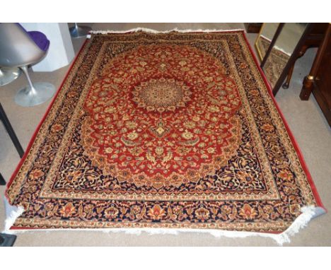 A red ground Keshan carpet, 280 x 200cm.