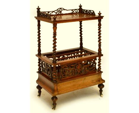 A Victorian walnut Canterbury whatnot, the upper tier with pierced gallery above barleytwist uprights, Canterbury lower secti