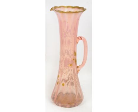 A late 19th century pink tinted glass jug with enamel painting overlay of chrysanthemums with gilt heightening, height 44cm.
