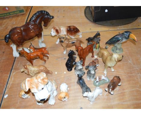 A large quantity of ceramic animals including a large Sylvac dog, two Sylvac Pekingese dogs, two Goebel dogs, a quantity of o