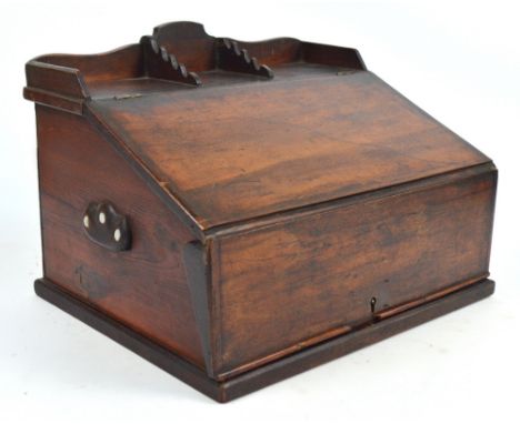 An early 19th century mahogany faced desk box/writing slope, the double hinged slope enclosing shelf and drawer, with mother 