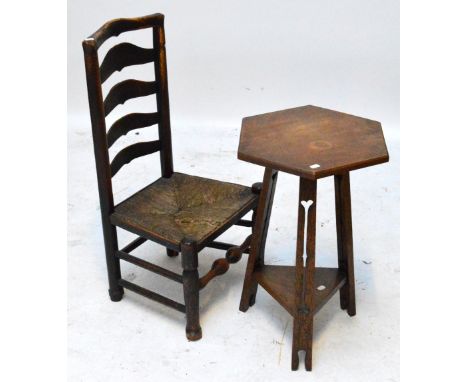 An early 20th century Arts and Crafts style hexagonal occasional table with shaped pierced decoration to the supports and tri