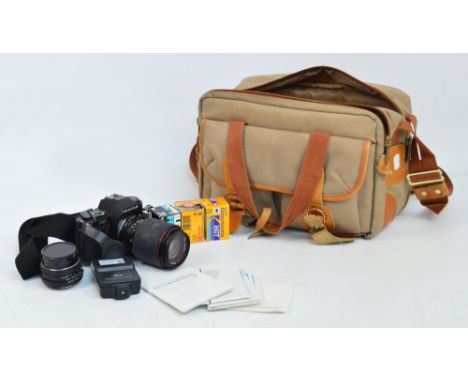 A Pentax P30 camera complete with case and various accessories.