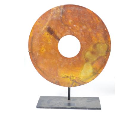 A Neolithic or Ming period jade bi disc, diameter 26cm, depth 5.5mm. CONDITION REPORT: Old chip to one rime. Some natural cra