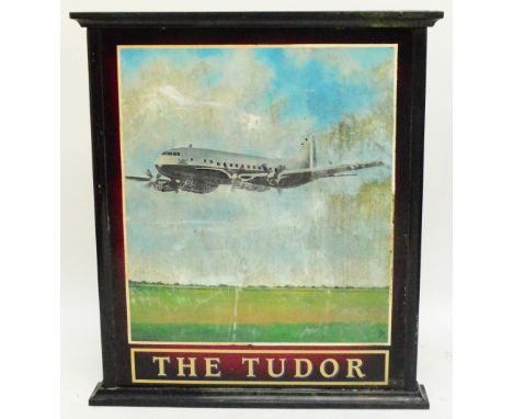 A large hand painted double sided pub sign "The Tudor", each main panel decorated with an aeroplane about to land, within a w