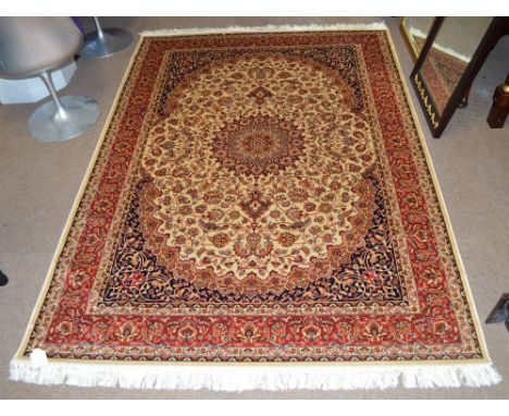 A beige ground Keshan carpet, 230 x 160cm.