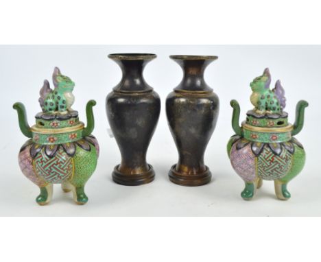 A pair of Chinese ceramic censers, the lids with temple lion finials and the bases decorated with acanthus leaves and geometr