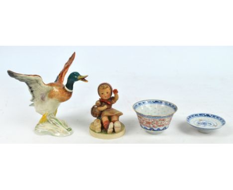 A Beswick figure of a mallard duck in flight, stamped to base number 749, height 17cm, width 21.5cm, a Hummel figure of a sea