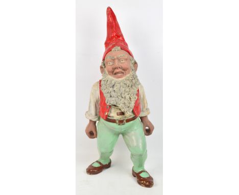 A Victorian plaster standing garden gnome with a red hat and bushy beard, overpainted, height 82.5cm. CONDITION REPORT: A sma