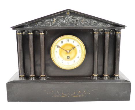 A 19th century French slate mantel clock modelled as a portico with pillars and tympanum, the dial set with Arabic numerals, 