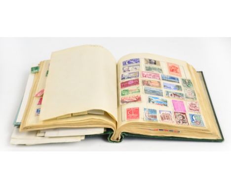 A collection of British and world stamps contained in a Cardinal stamp album to include China, Italy, Kenya, France, etc, als