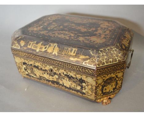 An Early 19th Century Chinese Export Lacquered Tea Caddy of octagonal form, the hinged cover enclosing a fitted interior, rai