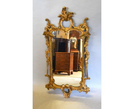 A Gilt Frame Wall Mirror With Scroll Cresting, 108 by 57cm 