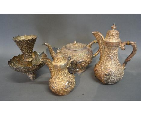 An Indian White Metal Four Piece Tea Service, comprising teapot, hot water pot, cream jug and center piece, 62oz 