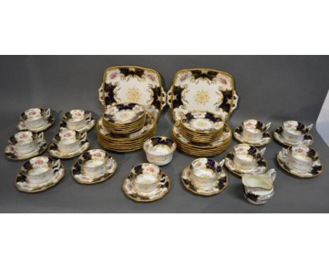 A Coalport Porcelain Twelve Place Setting Tea Service, comprising twelve plates, twelve side plates, twelve cups and saucers,