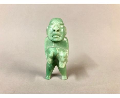 Pre-Columbian Jade Carving of a Man with an Animal. Age Unknown.Height: 3.5 in.