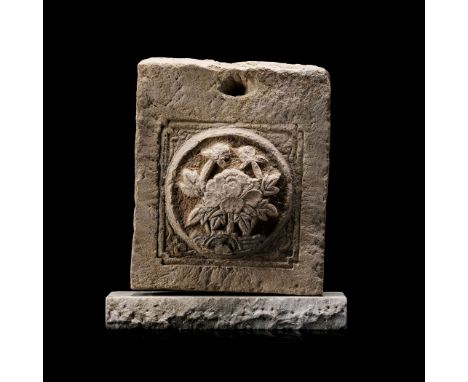 A CHINESE SANDSTONE ARCHITECTURAL CARVING, MING DYNASTY, 1368 – 1644 the rectangular tile carved to the domed centre with a l