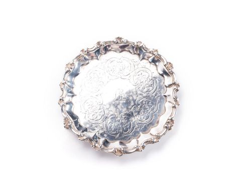 AN ENGLISH SILVER SALVER, GEORGE JOHN RICHARDS, LONDON, 1851 of shaped circular form with ﬂowerhead and scroll border, the ce