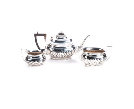 AN ENGLISH SILVER TEA SET,THOMAS WILLMORE, BIRMINGHAM, 1910 comprising: a teapot, a milk jug and a two handled sugar basin, e