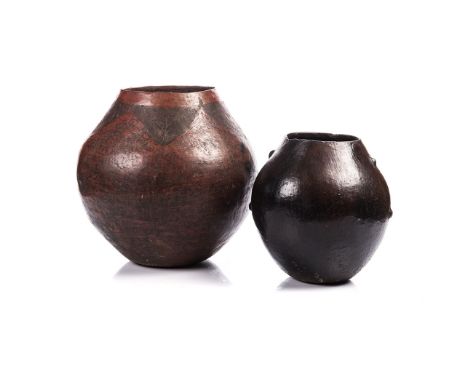 TWO CLAY POTS, (LEFISO), SOUTH SOTHO the tallest 36cm highTraditional clay pots continue to be made throughout Southern Afric