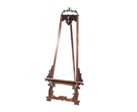 A FRENCH WALNUT EASEL, 19TH CENTURY surmounted by a gilt-metal oak leaf cresting, on scrolling and foliate carved feet 183cm 