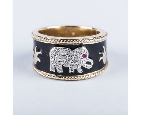 A BLACK ENAMEL AND DIAMOND ELEPHANT RING the elephant pavéd with white diamonds and a ruby fashioned as an eye, centred in bl