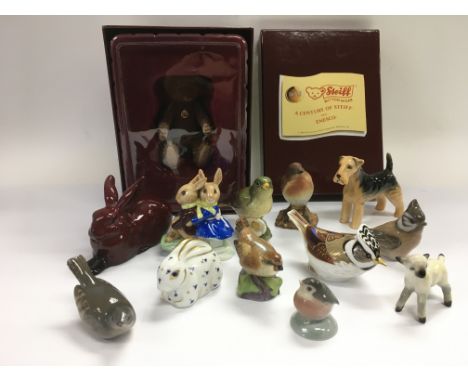 A collection of ceramic animal figures comprising examples by Beswick, Royal Copenhagen, a flambe Royal Doulton rabbit and a 