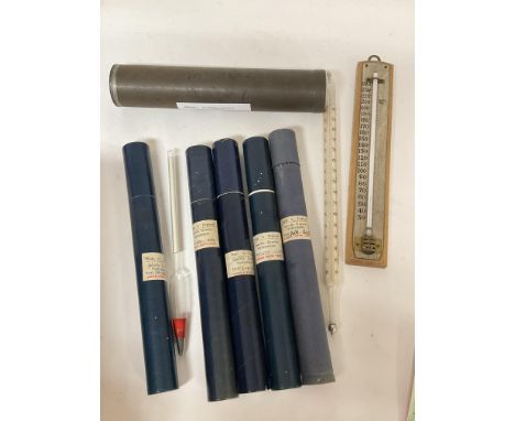 A collection of seven hydrometers, mostly in their original boxes and of varying ranges and one thermometer.