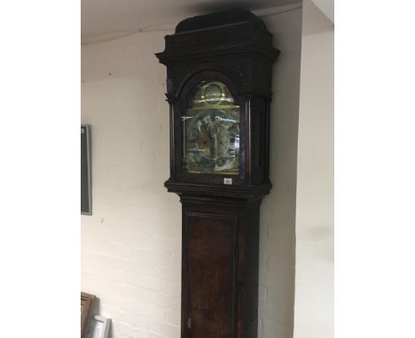 A George II 18th Century Walnut long case clock with a caddy top and fretwork panels the brass dial with silver chapter ring 