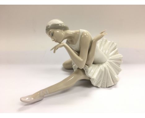 A Lladro figure of a ballerina.