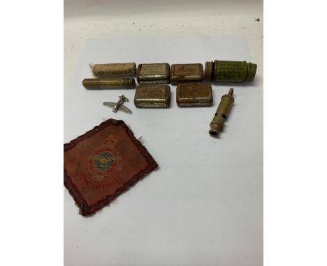 A collection of small military items including medical supplies and a Royal Air Force arm patch.
