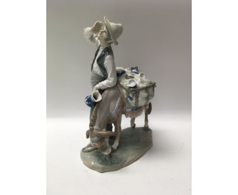 A Lladro figure group depicting a China seller with donkey. With box ,