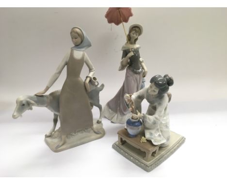 Three Lladro figures of ladies, tallest approx 32cm.