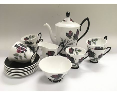 A Royal Albert tea service in Masquerade pattern.