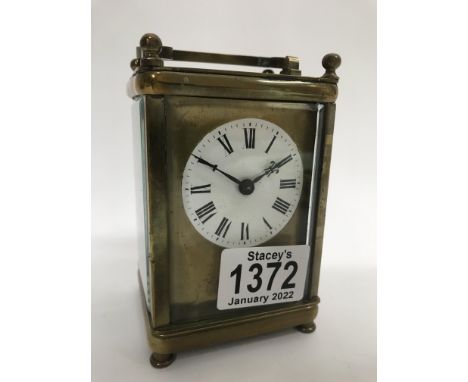 A brass cased carriage clock, the dial with Roman numerals 11cm x 7.2cm approx - NO RESERVE