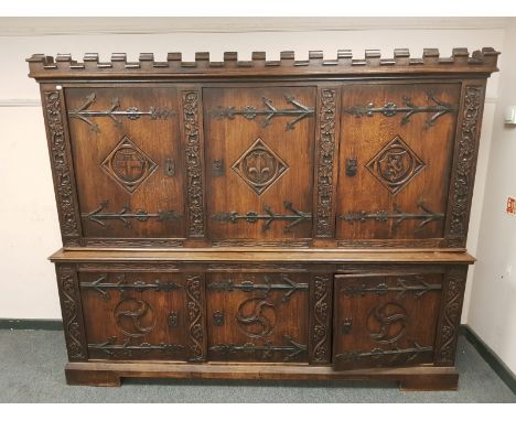 A good quality carved oak sideboard, with castellated frieze, width 227 cm  CONDITION REPORT: 56.5 cm deep at the base and 46