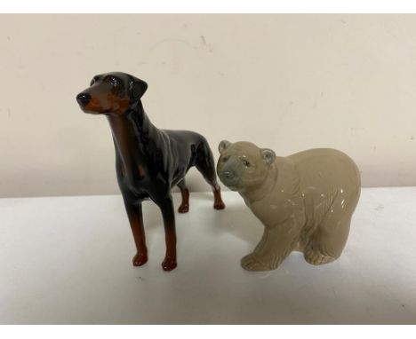 A Lladro figure of a polar bear together with a Beswick doberman 