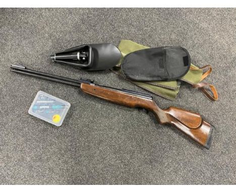 A BSA .22 calibre air rifle (barrel and stock not screwed together), in soft case, together with a folding shovel and a cased