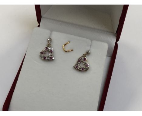 A pair of 10ct gold ruby and diamond set heart earrings 