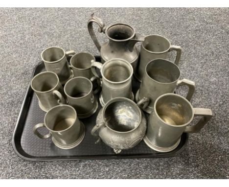 A tray of antique pewter ware - tankards, coffee pot, sugar basin 